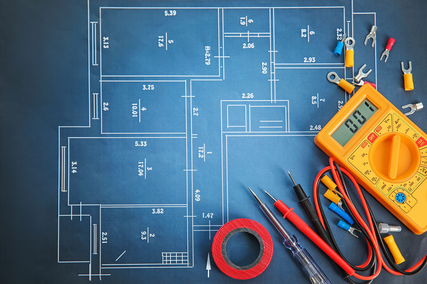 Flat lay composition with electrical tools on house plan